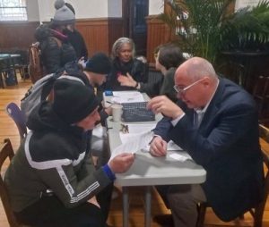 paul explaining finer points to asylum seeker sharper resized for newsletter