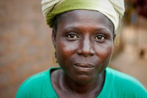 hope eden, nigeria october 12, 2010: woman in front of her house.